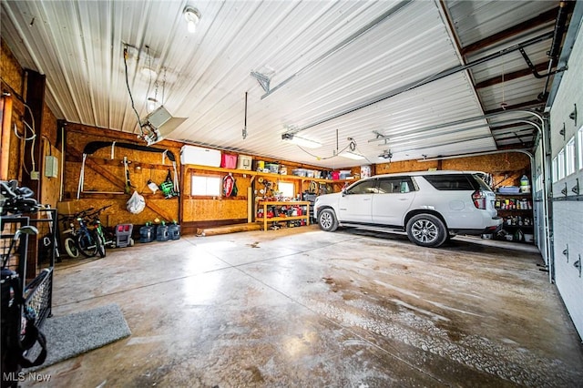 9012 Winesburg Rd, Dundee, OH 44624 - garage with a workshop area and a garage door opener