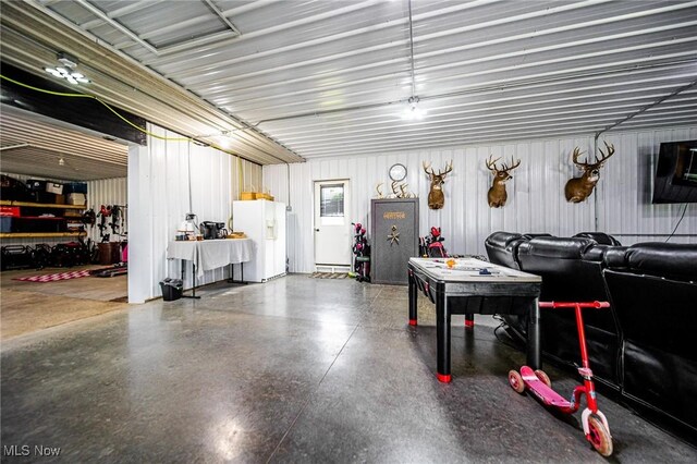 9012 Winesburg Rd, Dundee, OH 44624 - garage with white refrigerator with ice dispenser