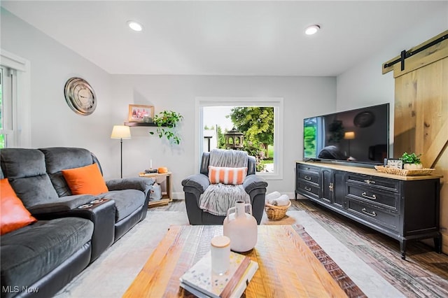 9012 Winesburg Rd, Dundee, OH 44624 - living room with wood finished floors, a barn door, and recessed lighting