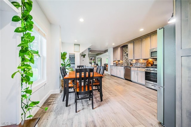 9012 Winesburg Rd, Dundee, OH 44624 - dining room with healthy amount of natural light, light wood-type flooring, baseboards, and recessed lighting