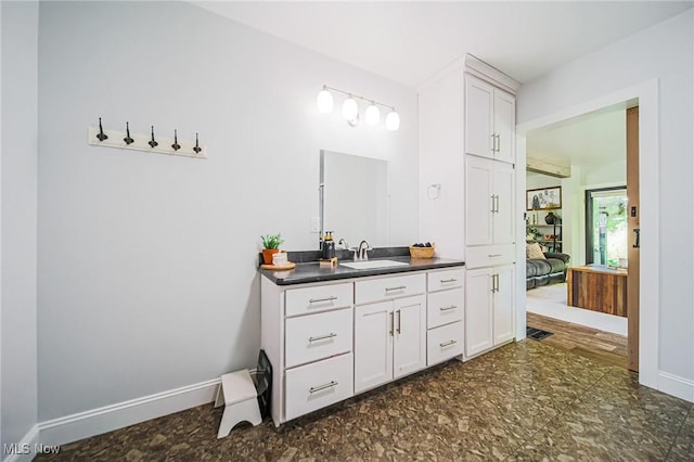 9012 Winesburg Rd, Dundee, OH 44624 - ensuite bathroom featuring vanity and baseboards