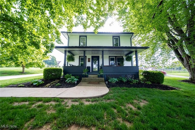 9012 Winesburg Rd, Dundee, OH 44624 - view of front of home with covered porch and a front lawn