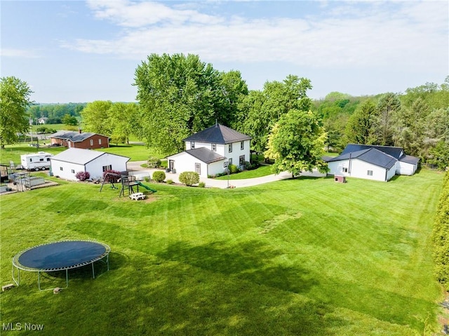 9012 Winesburg Rd, Dundee, OH 44624 - view of grassy yard featuring a trampoline