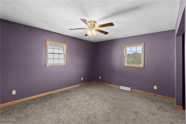 68290 Orchard Ave, Bridgeport, OH 43912 - carpeted spare room with plenty of natural light, a ceiling fan, and baseboards