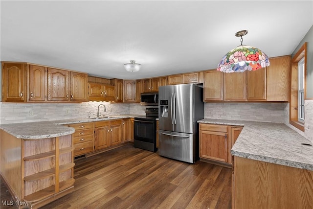 68290 Orchard Ave, Bridgeport, OH 43912 - kitchen featuring stainless steel appliances, a sink, light countertops, decorative backsplash, and dark wood finished floors