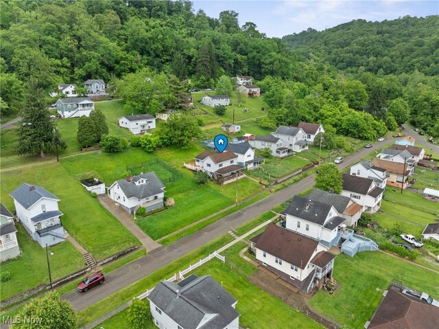 68290 Orchard Ave, Bridgeport, OH 43912 - aerial perspective of suburban area with a heavily wooded area