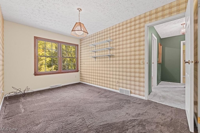 12935 Robinwood St NE, Alliance, OH 44601 - spare room with a textured ceiling, carpet floors, baseboards, and wallpapered walls
