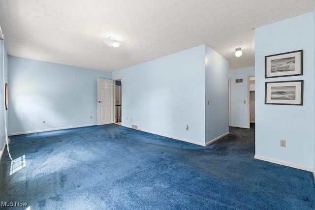 12935 Robinwood St NE, Alliance, OH 44601 - unfurnished room featuring a textured ceiling, carpet, and baseboards