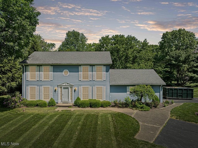 12935 Robinwood St NE, Alliance, OH 44601 - colonial house with a front yard and roof with shingles
