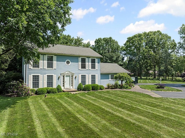 12935 Robinwood St NE, Alliance, OH 44601 - colonial inspired home with a front lawn