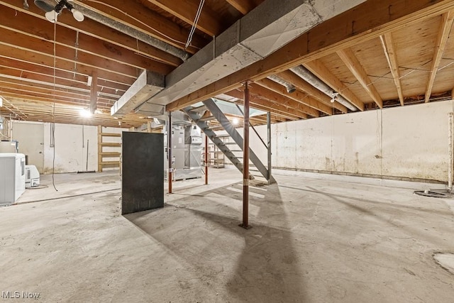 12935 Robinwood St NE, Alliance, OH 44601 - unfinished below grade area featuring stairs and washer and dryer
