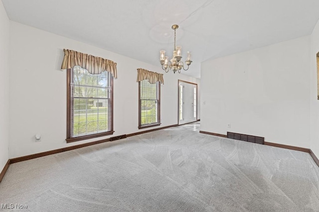 12935 Robinwood St NE, Alliance, OH 44601 - unfurnished room with a chandelier, baseboards, and carpet floors