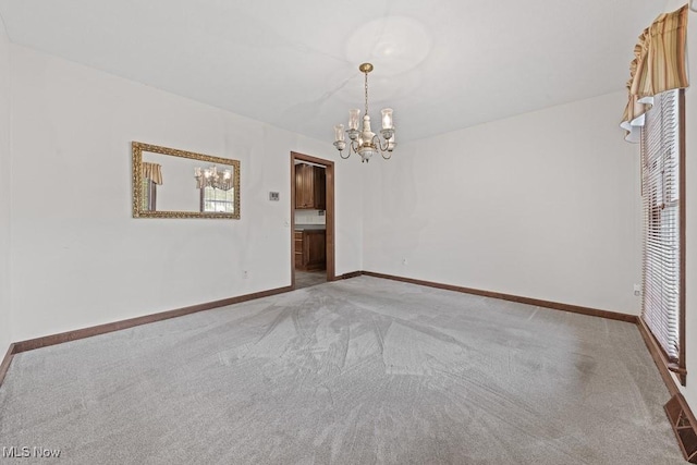 12935 Robinwood St NE, Alliance, OH 44601 - unfurnished room with a chandelier, carpet, and baseboards