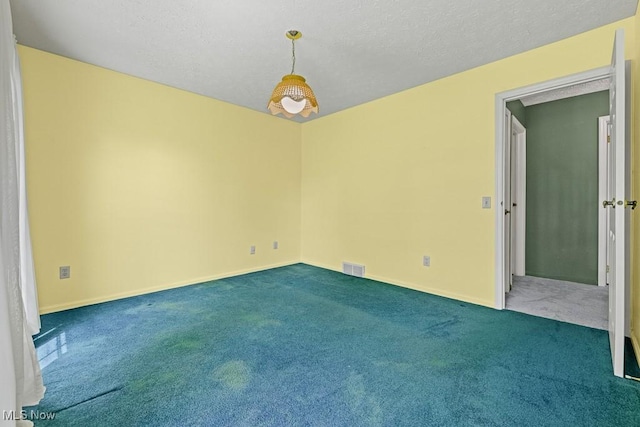 12935 Robinwood St NE, Alliance, OH 44601 - empty room with carpet floors, baseboards, and a textured ceiling