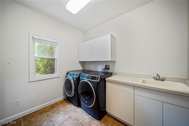 7776 Keystone Dr, Concord, OH 44077 - washroom with cabinet space, independent washer and dryer, baseboards, tile patterned flooring, and a textured ceiling