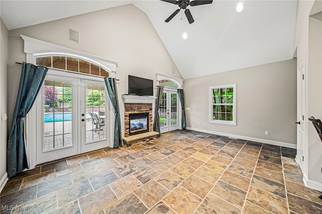 7776 Keystone Dr, Concord, OH 44077 - unfurnished living room featuring french doors, high vaulted ceiling, stone tile floors, ceiling fan, and baseboards