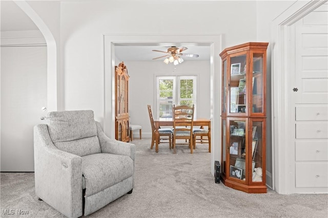 226 N 19th St, Sebring, OH 44672 - sitting room with a ceiling fan, carpet flooring, arched walkways, and baseboards