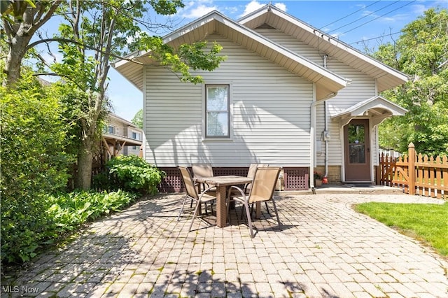 226 N 19th St, Sebring, OH 44672 - rear view of property with a patio area and outdoor dining area