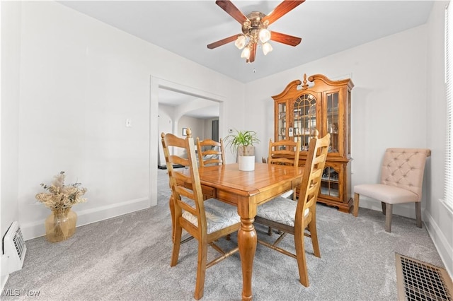 226 N 19th St, Sebring, OH 44672 - dining space featuring light carpet, a ceiling fan, and baseboards
