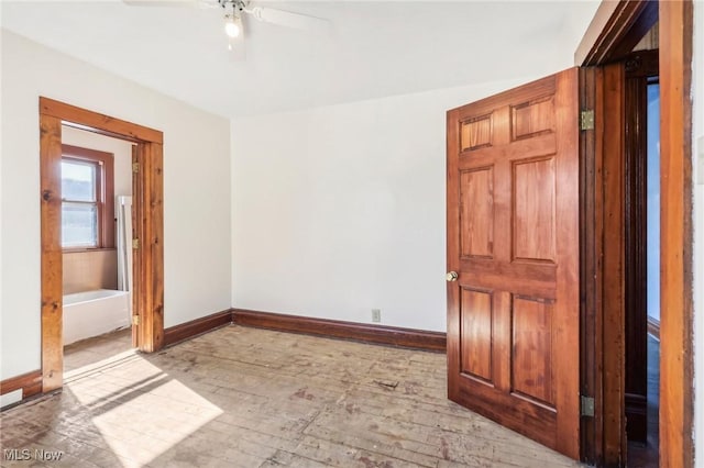 604 E Lincoln Way, Lisbon, OH 44432 - empty room featuring ceiling fan, baseboards, and light wood-style flooring