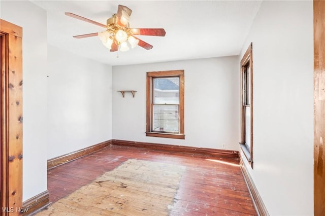 604 E Lincoln Way, Lisbon, OH 44432 - empty room featuring wood-type flooring, ceiling fan, and baseboards