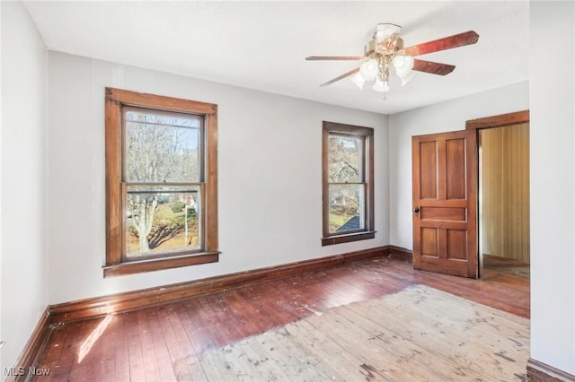 604 E Lincoln Way, Lisbon, OH 44432 - empty room with hardwood / wood-style flooring, baseboards, and ceiling fan
