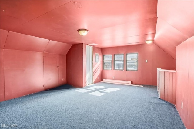 604 E Lincoln Way, Lisbon, OH 44432 - additional living space with lofted ceiling, carpet floors, and a baseboard radiator