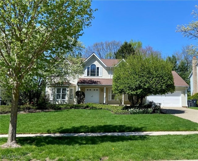 33939 Hanover Woods Trl, Solon, OH 44139 - view of front facade with driveway, a front yard, and a garage