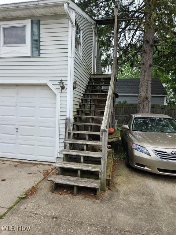 5102 Andrus Ave, North Olmsted, OH 44070 - view of home's exterior with stairway and an attached garage