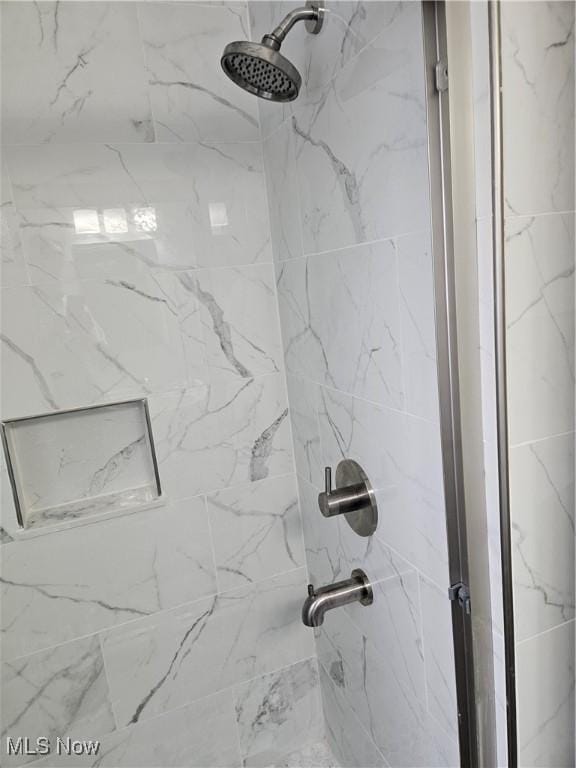 5102 Andrus Ave, North Olmsted, OH 44070 - detailed view of a marble finish shower
