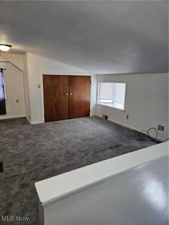 5102 Andrus Ave, North Olmsted, OH 44070 - additional living space with carpet flooring, baseboards, and lofted ceiling