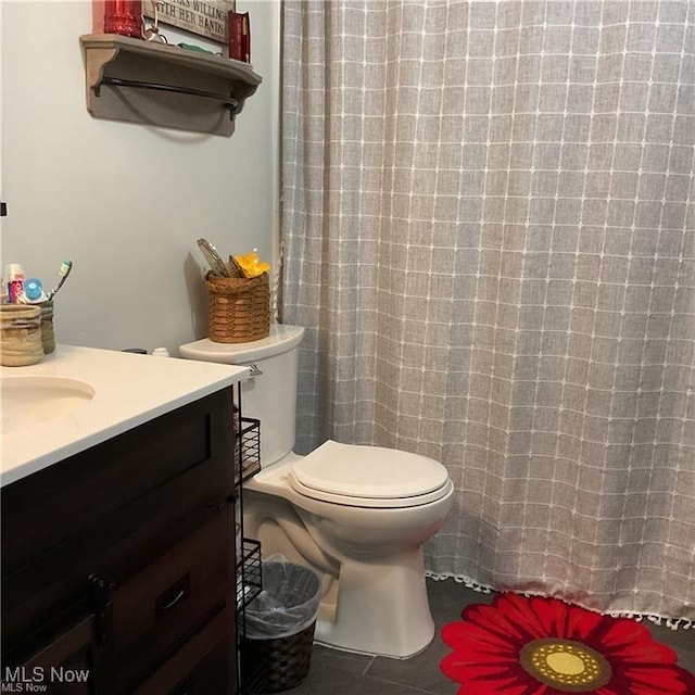 71276 Old Twenty One St, Kimbolton, OH 43725 - full bathroom featuring vanity, toilet, curtained shower, and tile patterned flooring