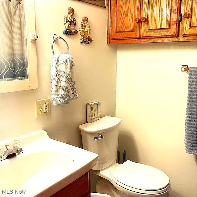 71276 Old Twenty One St, Kimbolton, OH 43725 - bathroom featuring toilet and vanity