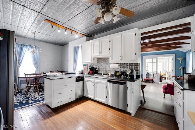 28900 Euclid Ave, Wickliffe, OH 44092 - kitchen with appliances with stainless steel finishes, a sink, a peninsula, and white cabinets