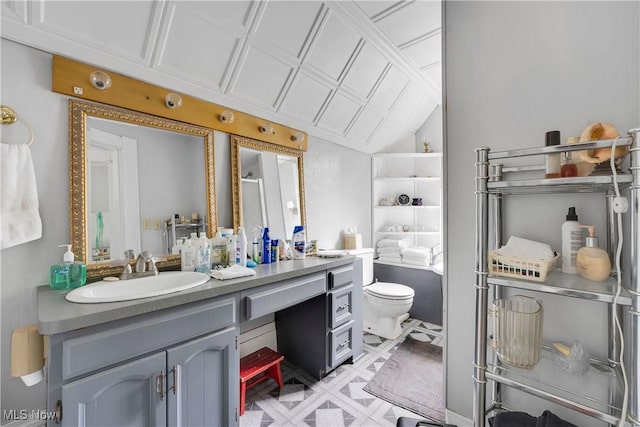 28900 Euclid Ave, Wickliffe, OH 44092 - bathroom with vanity, toilet, and vaulted ceiling