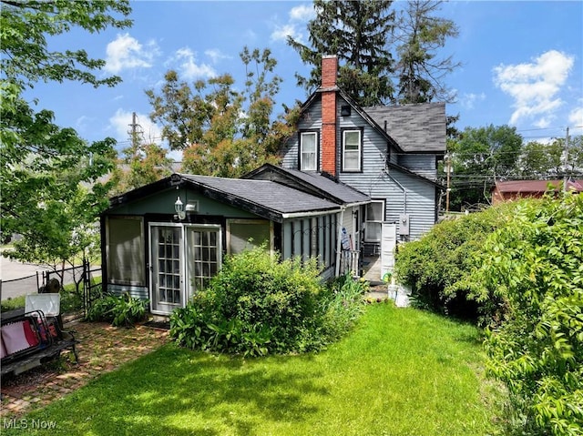 28900 Euclid Ave, Wickliffe, OH 44092 - back of property with a shingled roof and a chimney