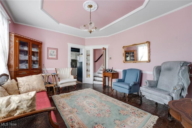 28900 Euclid Ave, Wickliffe, OH 44092 - living area with stairs, a raised ceiling, crown molding, wood finished floors, and a chandelier