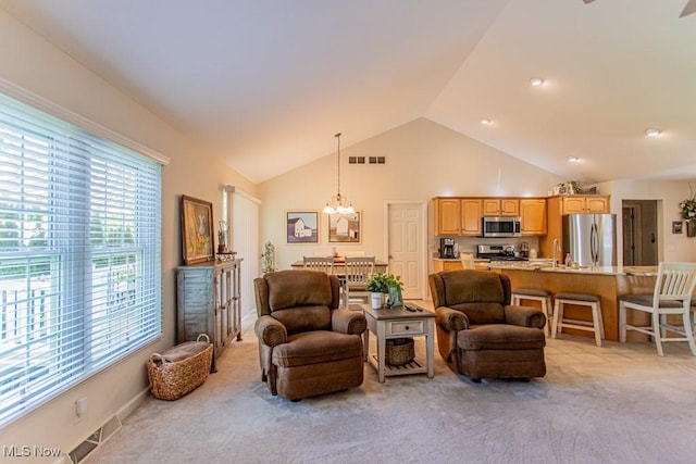 8121 Hitchcock Rd Unit 1, Youngstown, OH 44512 - living room featuring plenty of natural light, a chandelier, light colored carpet, and high vaulted ceiling