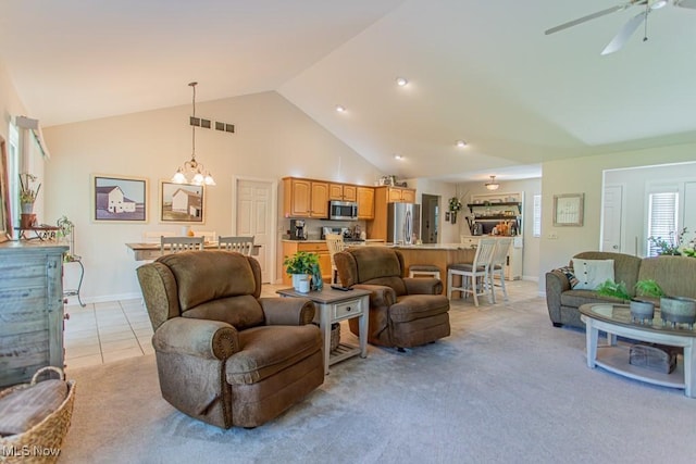 8121 Hitchcock Rd Unit 1, Youngstown, OH 44512 - living area with a ceiling fan, high vaulted ceiling, light colored carpet, baseboards, and a chandelier