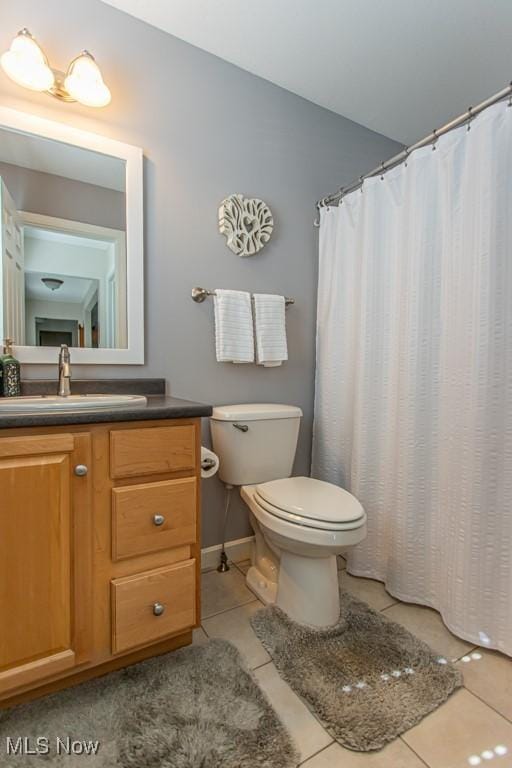 8121 Hitchcock Rd Unit 1, Youngstown, OH 44512 - full bathroom with tile patterned floors, toilet, and vanity