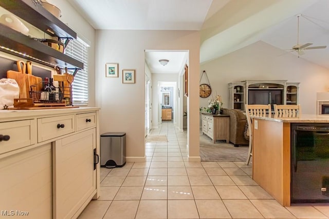 8121 Hitchcock Rd Unit 1, Youngstown, OH 44512 - kitchen featuring a ceiling fan, open floor plan, light tile patterned floors, beverage cooler, and vaulted ceiling