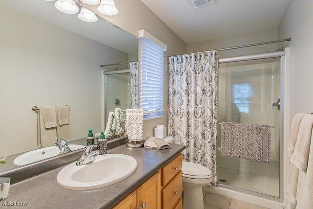 8121 Hitchcock Rd Unit 1, Youngstown, OH 44512 - bathroom with a shower stall, tile patterned flooring, vanity, and toilet