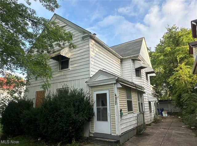 6701 Gertrude Ave, Cleveland, OH 44105 - view of property exterior featuring entry steps and a patio area
