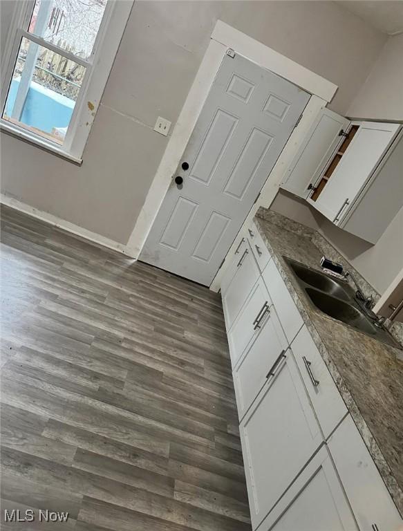 6701 Gertrude Ave, Cleveland, OH 44105 - bathroom featuring vanity and wood finished floors