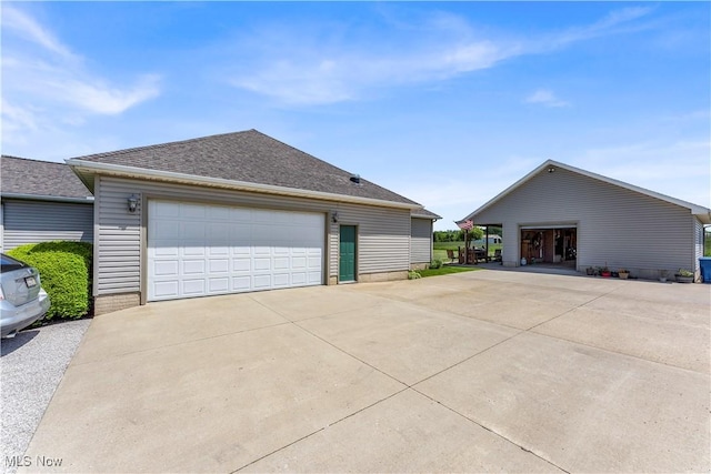 9903 Vermilion Rd, Amherst, OH 44001 - view of home's exterior with a detached garage