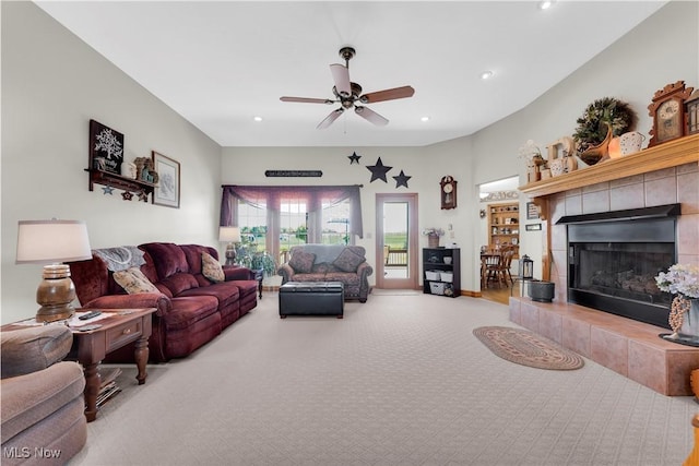 9903 Vermilion Rd, Amherst, OH 44001 - carpeted living area with a tile fireplace, ceiling fan, and recessed lighting