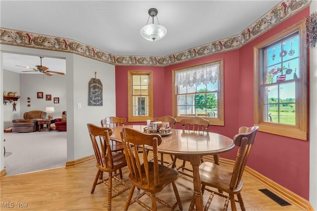 9903 Vermilion Rd, Amherst, OH 44001 - dining space featuring light wood-type flooring and baseboards