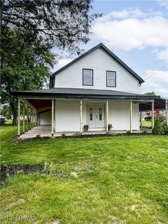 23 2nd St, West Salem, OH 44287 - country-style home with covered porch and a front lawn