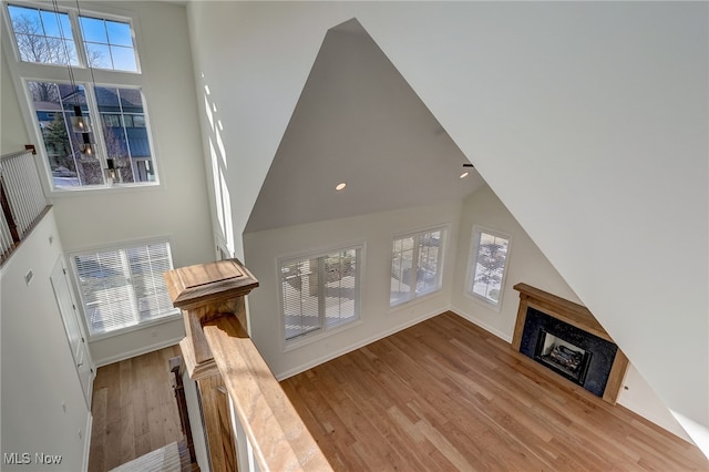 2540 Edgewood Trce, Pepper Pike, OH 44124 - unfurnished living room featuring wood finished floors, a fireplace, high vaulted ceiling, recessed lighting, and baseboards