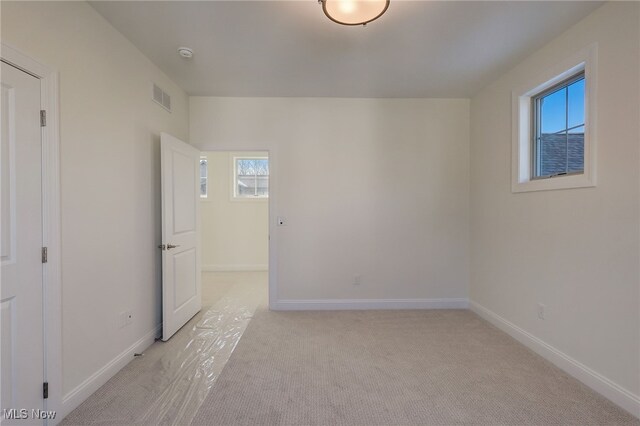 2540 Edgewood Trce, Pepper Pike, OH 44124 - unfurnished bedroom with light colored carpet, multiple windows, and baseboards
